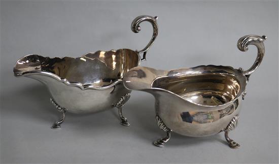 Two early 20th century silver sauceboats with flying scroll handles, 20 oz.